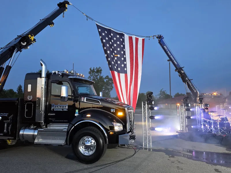 Preferred trucks and American flag at dusk