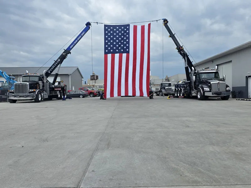 Two Preferred rotators displaying a large American flag